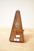 A 20th-century French Maelzel metronome, featuring a classic pyramid-shaped polished hardwood case