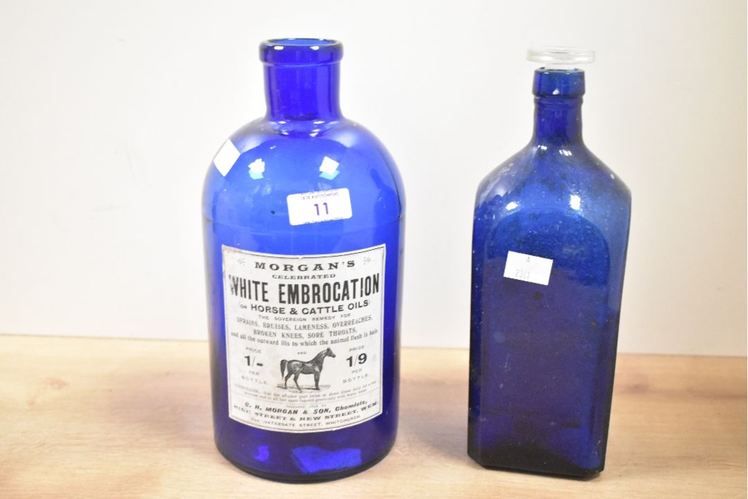 Two late 19th-century dark blue glass containers, to feature a bottle of J. Morgan and Sons 'White - Image 1 of 3