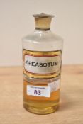 A single Victorian Apothecary bottle, with glass stopper and label reading 'CREASOTUM', 15cm,