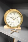 A late 19th to early 20th-century British brass ships bulkhead clock
