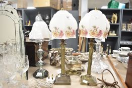 Three 20th-century table lamps with glass shades, to include a set of two lamps with brass bases