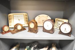 A collection of eight early 20th century bakelite and faux tortoiseshell mantel clocks and