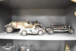 Three 20th-century metal model racing cars, to include a MG Magnette K3 popular in the 1930s, a 1928