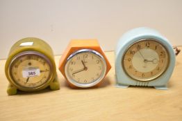 A 1930's Art Deco orange bakelite Goblin electric mantel clock, of hexagonal form with Arabic hours,