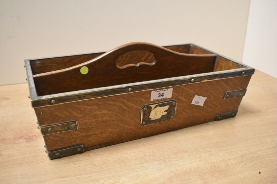 A Victorian oak cutlery caddy with metal hardware, having an initialled front plaque reading ‘KH’ in - Image 1 of 5