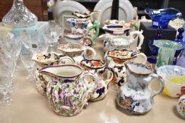 A large selection of Mason's Ironstone and similar jugs, twelve in total.