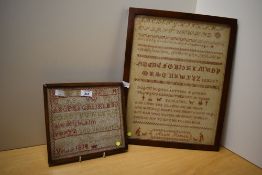 Two Georgian framed needlework samplers, featuring alphabet letters, mottos and small motifs in