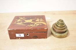 A set of early 20th-century brass nesting weights, compromising of eight weights with various makers