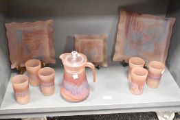 A frosted glass pitcher decorated in purple and blue iridescent patterns, h21cm, sold together