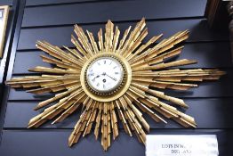 A large 19th-century French Giltwood Sunburst wall clock by Japy Frères, featuring numerous