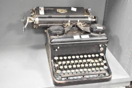 An early 20th-century Royal manual typewriter, featuring elegantly shaped keys in a black finish,