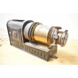 A Victorian brass and tin Magic Lantern, unmarked, 46cm, condition is consistent with age and use,
