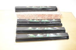 Four black lacquered mahjong tile racks, complete with box.