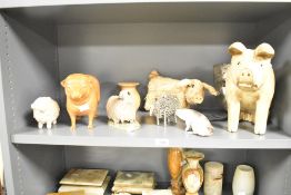 A quantity of 20th-century decorative farmyard animal sculptures, to include a Christine Cummings
