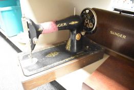 A vintage Singer sewing machine, serial number Y4191700 complete with lockable case and key.