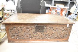 A large 20th century carved oak bible box, having two interior drawers, measures 65cm x 36cm 21cm.