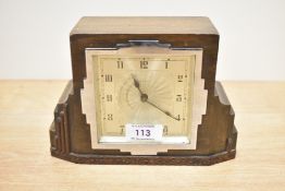 A early 20th-century British Art Deco wooden mantel clock, thought to be walnut, of geometric