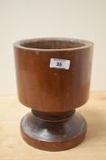 A large 20th-century 'treen' apothecary mortar, made from a single piece of wood, unmarked, 22cm,