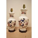Two 20th-century Masons Ironstone Blue Mandalay patterned table lamps, featuring delicate floral