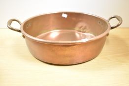 A large Victorian copper preserve pan with twin handles, 38cm, condition is consistent with age