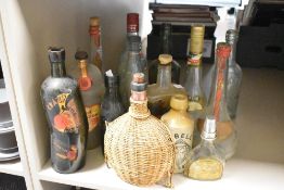 A collection of fourteen 20th-century bottles, including, for example, Jonas Alexander & Sons of