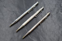 Three round Yard o Led hallmarked Silver mechanical pencils. Dated London 1938, 1948 and 1965