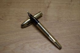 A Sheaffer Triumph touchdown fill fountain pen in Gold Fill having Sheaffer 14K Aust nib. Circa