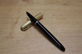 A boxed Parker 51 aerometric fill fountain pen and pencil set in Black with God fill with converging