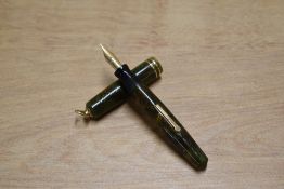 A Wahl Lady lever fill fountain pen in Green and Gold Marble with two narrow cap bands to ring top