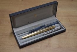 A boxed Parker 65 Insignia cartridge/ converter fill fountain pen in Rolled Gold