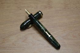 A Conklin lever fill fountain pen in Green vertical stripes with single cap band having Warranted
