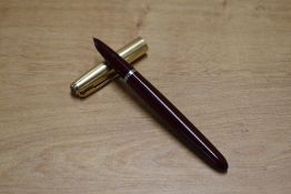 A boxed Parker 51 aerometric fill fountain pen in Burgundy with Rolled Gold cap
