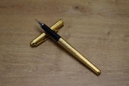 A Parker 180 converter fill fountain pen in Gold Fine Barley