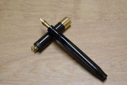 A Parker Duofold Lady de Luxe button fill Flat top fountain pen in Black with wide band to ring
