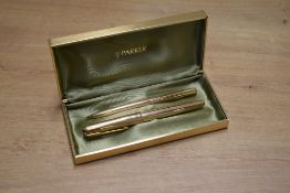 A boxed Parker 61 Insignia capillary fill fountain pen and mechanical pencil in Rolled Gold