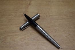 A boxed Parker 45 Harlequin cartridge converter fill fountain pen in stainless steel shield design