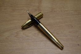 A Sheaffer Triumph Touchdown fill fountain pen in Gold Fill having Sheaffer's 14K nib. Circa 1973.