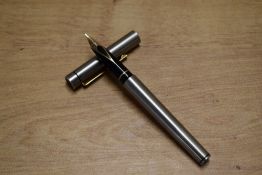 A Sheaffer Targa Cartridge Converter fountain pen in stainless steel having Sheaffer 14K 585 nib.
