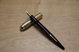 A Wahl Eversharp Skyline lever fill fountain pen in Black with Gold plated cap having Eversharp