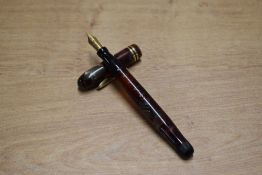 A Conklin Endura Wordguage twist fill fountain pen in Green and Red Marble with two narrow cap bands