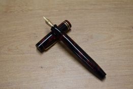 A boxed Parker Junior button fill Fountain pen and pencil set in Burgundy and Black Marble with