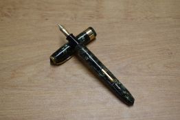 A Conway Stewart 27 lever fill fountain pen in Green Lined with single wide cap band having Conway