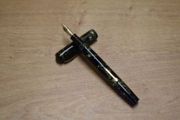 A boxed Conway Stewart lever fill fountain pen in Green Marble with single narrow cap band having