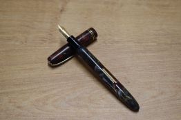 A Burnhan 55 lever fill fountain pen in Maroon and Grey Marble with two narrow cap bands having