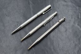 Three Yard o Led hallmarked Silver mechanical pencils. Dated London 1952 (engraved) and Birmingham