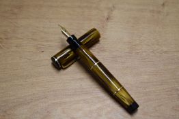 A Mabie Todd & Co Swan Leverless L330/64 twist fill fountain pen in Brown Amber having Swan 3 14C-