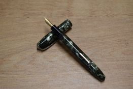 A Conway Stewart 75 lever fill fountain pen in Green and Black Marble with a single cap band
