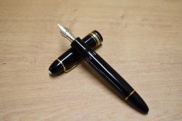 A boxed Montblanc Meisterstuck 149 piston fill fountain pen in black having 4810 Montblanc 18K 750