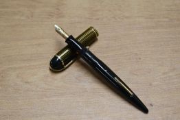 A Eversharp Skyline Slim lever fill fountain pen in Olive stripe with single cap band having