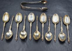 A cased set of eleven Edwardian silver Apostle spoons, of traditional form with a matching pair of